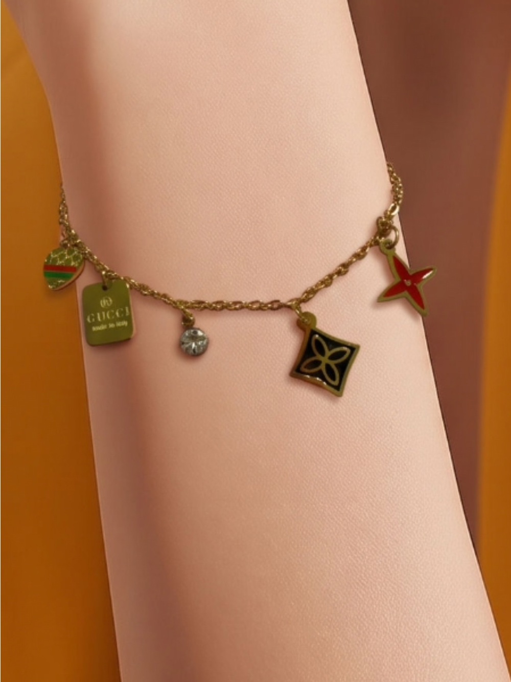 Gucci Gold-Tone Charm Bracelet with Green and Red Enamel Details
